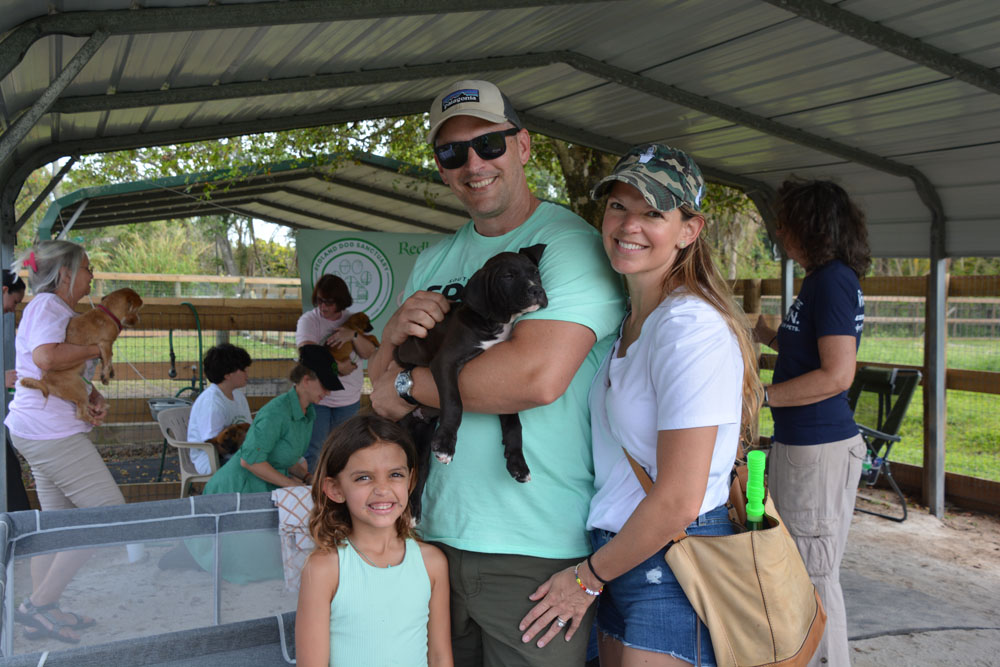 Family with Puppy - South Florida SPCA Open House 2024